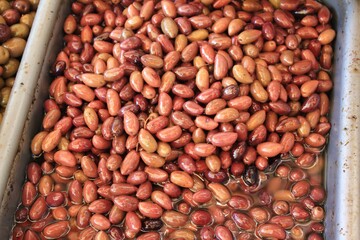 Stall with Kalamata or Kalamon olives at street market in Athens, Greece.