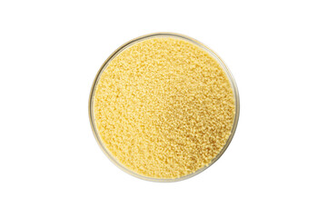 Bowl with raw couscous isolated on white background