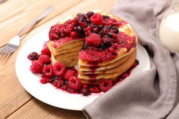 pancake pile with berry fruit syrup
