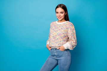 Fototapeta na wymiar Photo of cute attractive cheerful lady good mood beaming smile perfect long straight hairdo arms pockets wear casual warm sweater jeans isolated blue color background