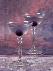 Aviation: a purple-bluish cocktail made with gin, maraschino, crème de violette and a dash of lemon juice, served with a maraschino cherry