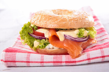 bagel sandwich with smoked salmon, vegetable and sauce
