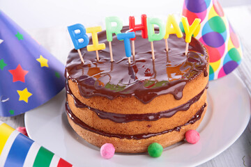 birthday cake with chocolate and festive decoration