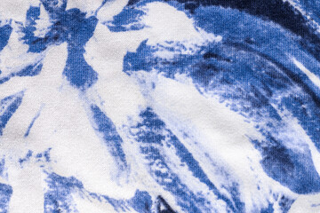 Tie-dye cotton fabric texture blue and white paint colors. Ancient resist-dyeing textile coloring...