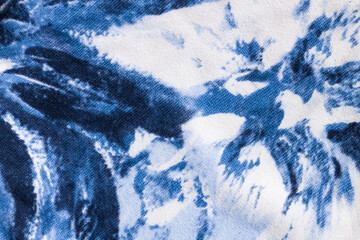 Tie-dye cotton fabric texture blue and white paint colors. Ancient resist-dyeing textile coloring...