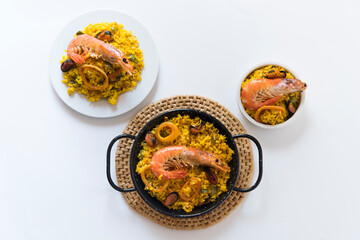 Paella typical spanish food in white background