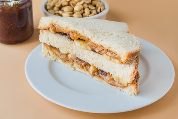 Peanut butter with bread and raspberry marmalade
