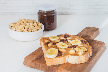 Peanut butter with bread and raspberry marmalade