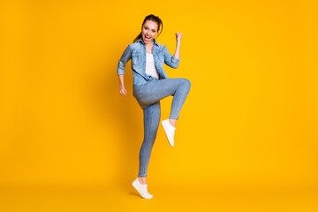 Fototapeta na wymiar Full size photo of delighted crazy girl achieve lucky lottery goal raise fists scream yeah wear good look outfit shoes isolated over bright color background