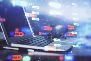 Double exposure of desktop computer and technology theme hologram. Concept of software development.