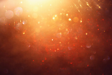 background of abstract gold and black glitter lights. defocused