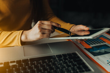 close up of hands working on a laptop