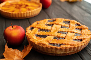 Close up of homemade traditional sweet autumn raspberry tart pie on wooden table