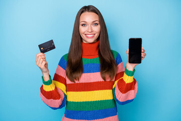 Portrait of her she nice attractive lovely cheerful cheery girl holding in hand device bank card...