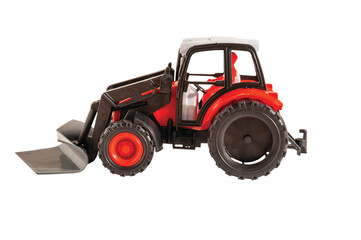 toy tractor ON A WHITE BACKGROUND, HORIZONTAL ORIENTATION, ISOLATED