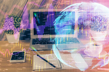 Double exposure of forex graph and work space with computer. Concept of international online trading.