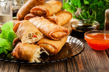 Spring rolls with chicken and vegetables served with sweet chili sauce or soy sauce