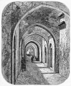 Pedestrian pointed arches tunnel in Tripoli, Libya, rue du Consulat. Ancient grey tone etching style art by Lancelot, published on Le Tour du Monde, Paris, 1861