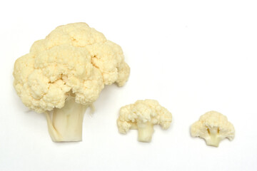 Three pieces of cauliflower on a white background.