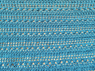 Handmade blue crochet scarf background