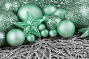 Christmas decoration ornaments and stars on silver background