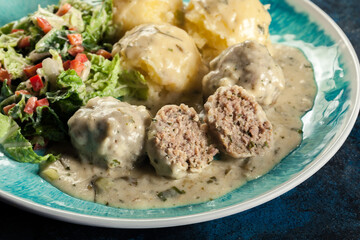 Meatballs with creamy and cheese gravy served with mashed potatoes