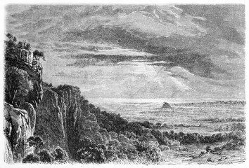 Vast australian flatland with vegetated rocky hill on left in Dalry station landscape, Victoria state, Australia. Ancient grey tone etching style art by Girardet, Le Tour du Monde, Paris, 1861 - 385230722