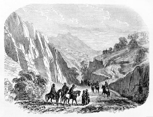 Path among rocky landscape in Taurus mountains (at present days Saimbeyli), Turkey, walked by horseback people. Ancient grey tone etching style art by Grandsire, Le Tour du Monde, Paris, 1861
