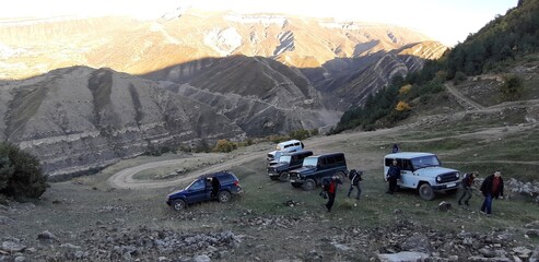 group of cars in the mountains
