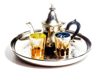 Group of teapot and glasses of oriental tea on a tray on white background