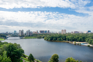 Fototapeta na wymiar Aerial view of residential buildings in the city of Khimki and the railway bridge across the Moscow canal