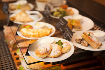 Delicious pancakes on plates for sale at local cafe