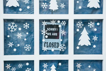 A sign on the door Sorry we are closed during the Christmas holidays or after sales.