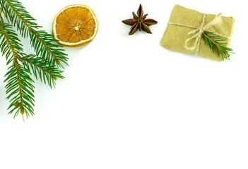 Christmas Happy New Year background. Spruce gift orange anise on white isolated background. View from above. Flat lay. Place for your text greeting