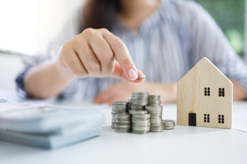 Saving money for Real estate investment with with stack of money coins for buying home and loan for...