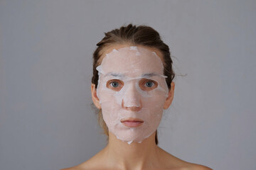 Korean cosmetic facial mask moisturizing, nutrition, hyaluronic acid, acne removal. Spa treatment face massage at home.