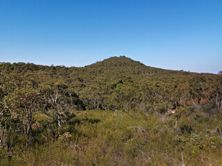 Beautiful afternoon view of mountain ranges, trees and deep blue sky from a trail, Willunga Trig Point Trail, Ku-ring-gai Chase National Park, Sydney, New South Wales, Australia
