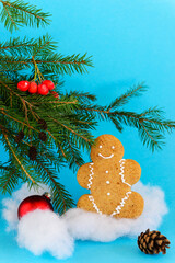 Gingerbread man on the background of the Christmas tree.