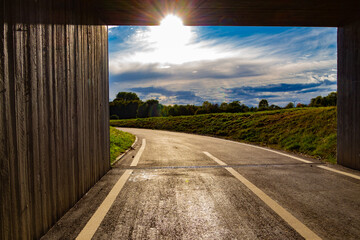 Sun shining through the end of a square tunnel