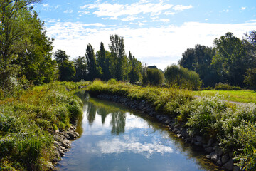 view of a countryside landscape with river and wild nature