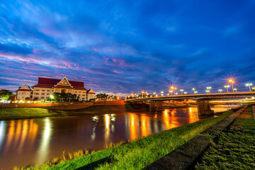 Natural evening at view the Nan River and the Naresuan Bridge in the park for relaxing walking jogging and exercise at sunset in Phitsanulok City, Thailand.