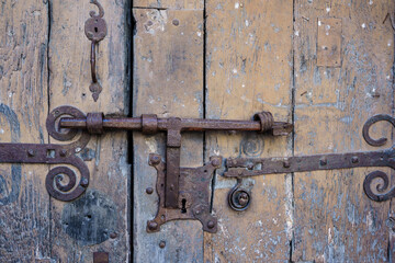 Old lock of a rusty door and with the old wood