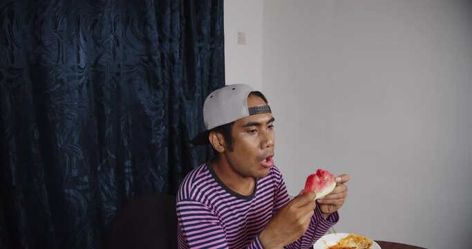 Asian Guy Eating Watermelon Medium Shoot