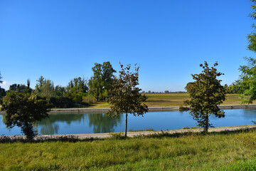 view of a countryside landscape with river and wild nature