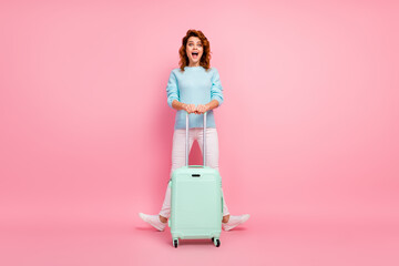 Fototapeta na wymiar Full length body size view of her she nice-looking attractive lovely pretty glad cheerful cheery wavy-haired girl carrying luggage having fun isolated over pink pastel color background