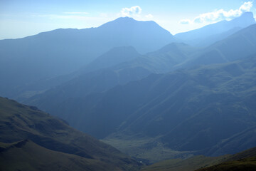 Alpine landscape with mountain peaks and green valleys. Caucasus, Russia. 