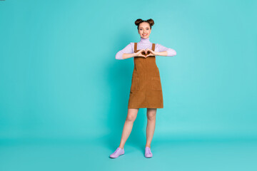 Full body photo of attractive charming pretty two lovely buns hairdo lady person show arms healthy heart wear purple pullover sneakers velvet brown dress isolated turquoise color background