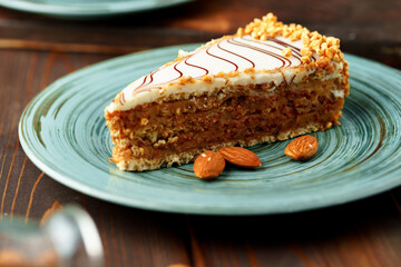 Piece of esterhazi cake on green plate
