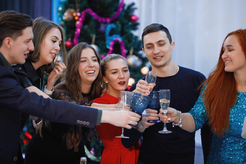 Merry Company of friends celebrates Christmas or New Year.