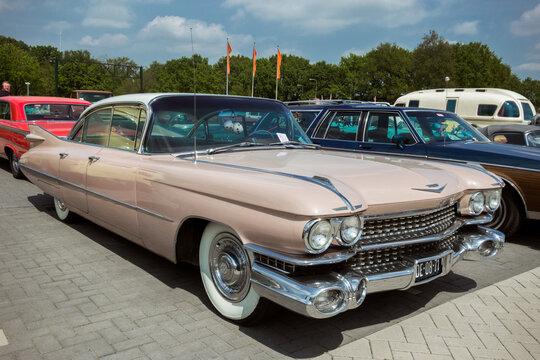 Pink 1959 Cadillac Sedan De Ville classic car. DEN BOSCH, THE NETHERLANDS - MAY 10, 2015.